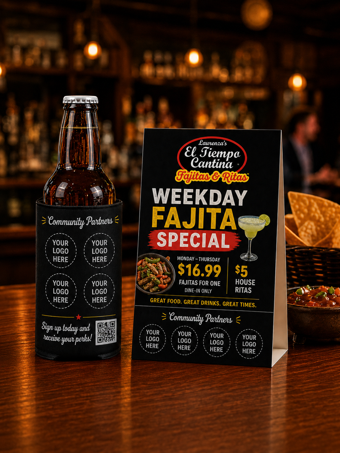 Branded table tent and drink koozie promoting a restaurant fajita special with community partner logos